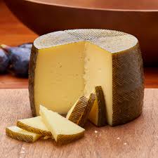 Manchego sheep milk cheese wheel