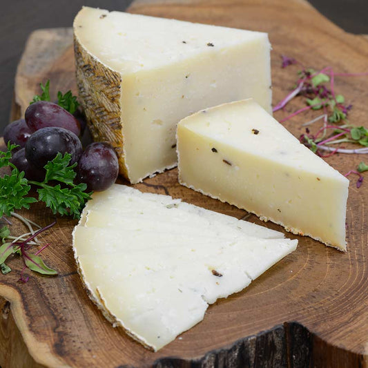Sheep milk cheese with truffle mushrooms wheel